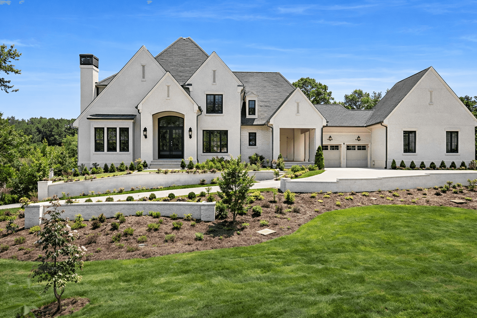 Custom estate home on wooded acreage at Blue Valley in Milton, GA