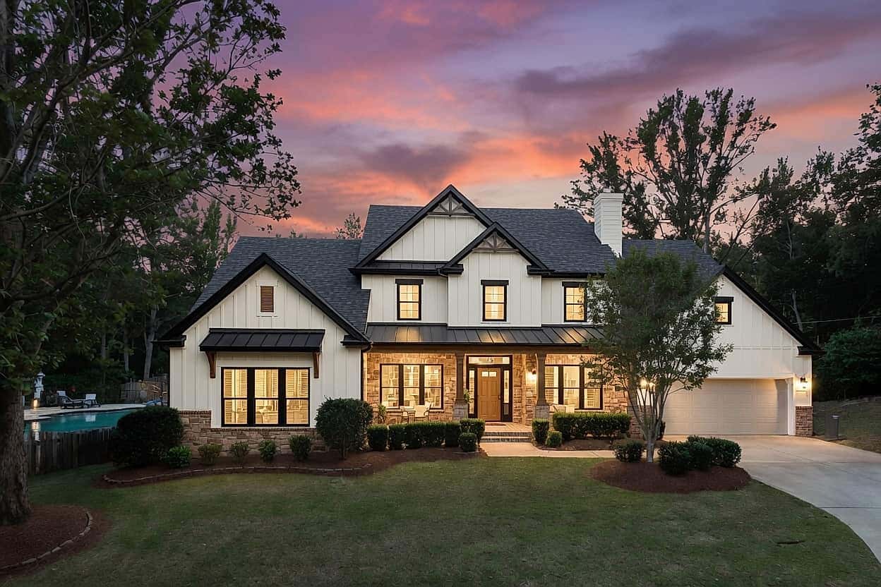 A luxury farmhouse estate in Milton, Georgia at twilight