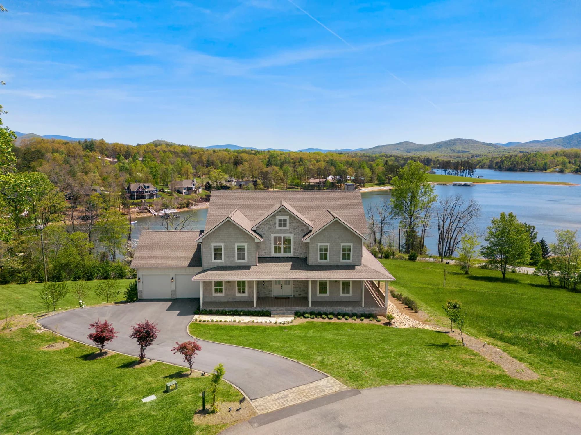 Aerial view of 173 Clearview Lane on Lake Nottely, framed by the North Georgia mountains.