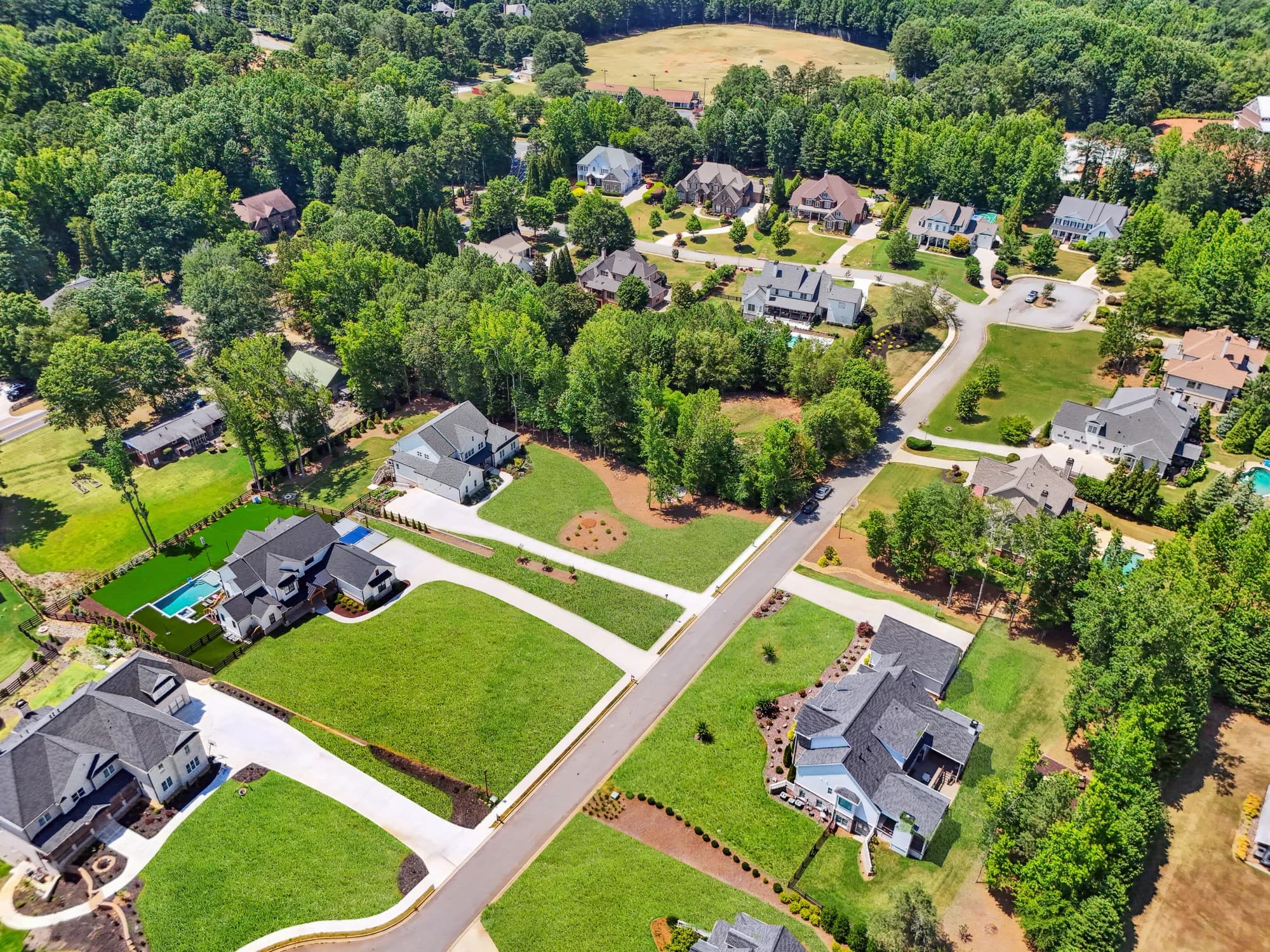 Aerial view of the home and its 1+ acre lot